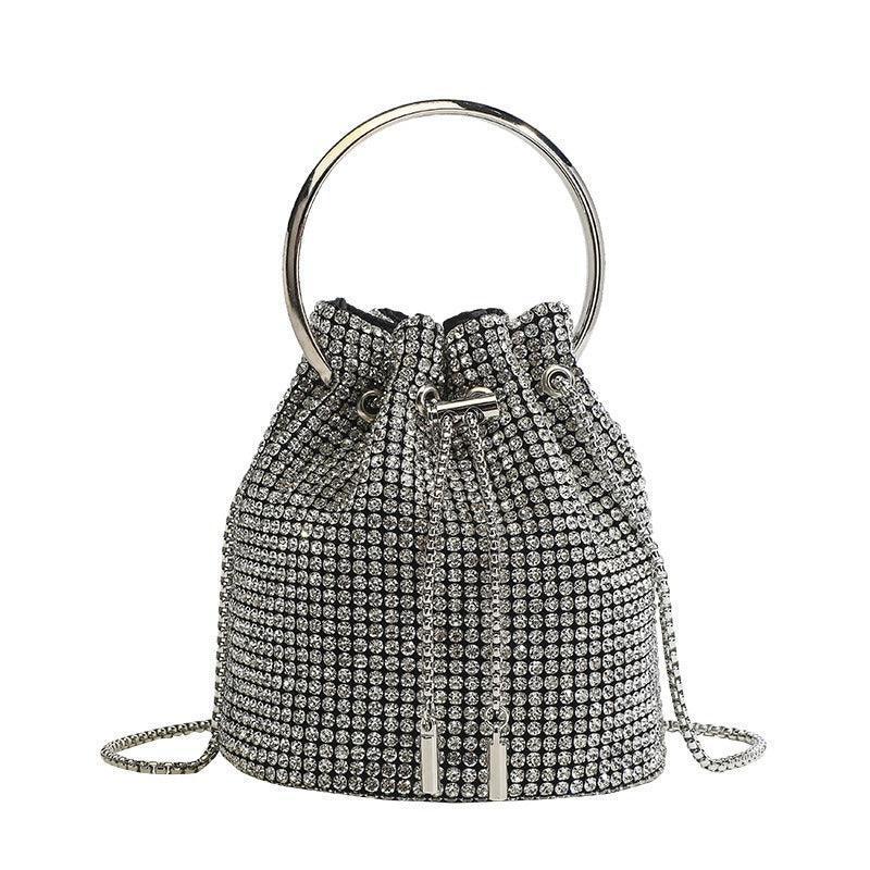 Bolso de mano con cadena de pedrería