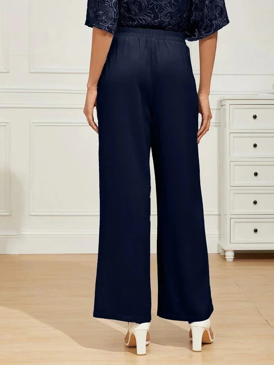 Pantalones de pierna ancha con cintura elástica de tiro medio y bolsillos