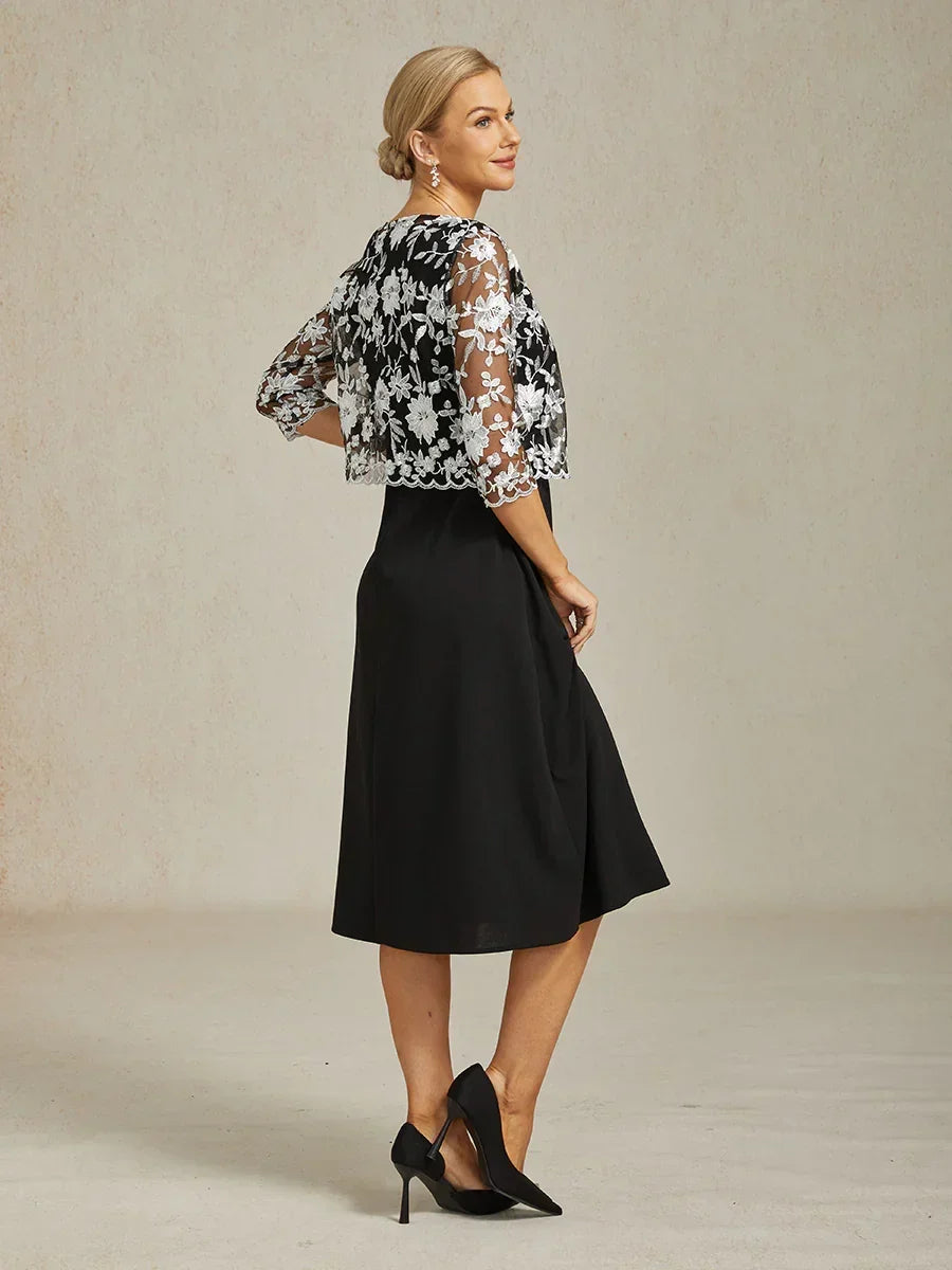 Blondejakke med blomsterbroderi og bølget kant