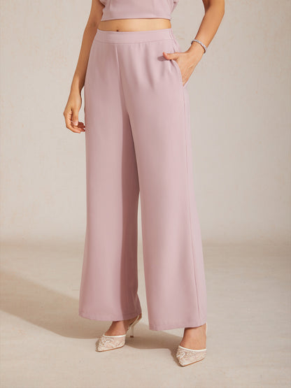 Pantalones de pierna ancha con cintura elástica de tiro medio y bolsillos