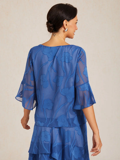 Blusa elegante in chiffon con orlo asimmetrico