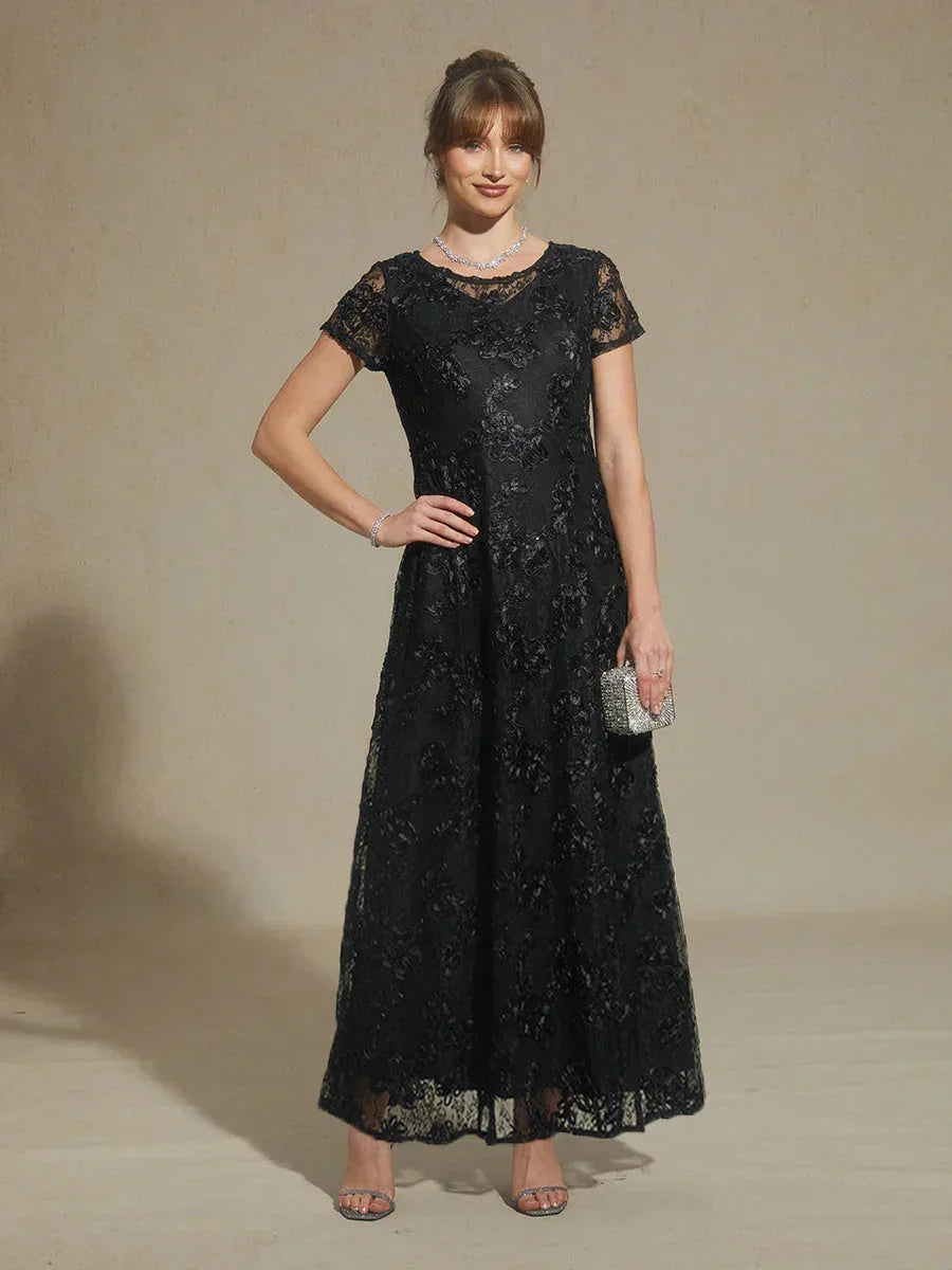 Abito a linea A con pizzo a rosetta e decorazioni in paillettes