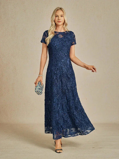 Abito a linea A con pizzo a rosetta e decorazioni in paillettes