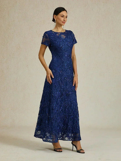 Abito a linea A con pizzo a rosetta e decorazioni in paillettes