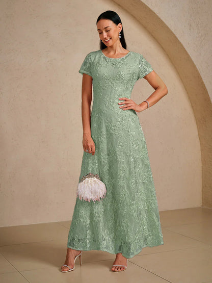 Abito a linea A con pizzo a rosetta e decorazioni in paillettes