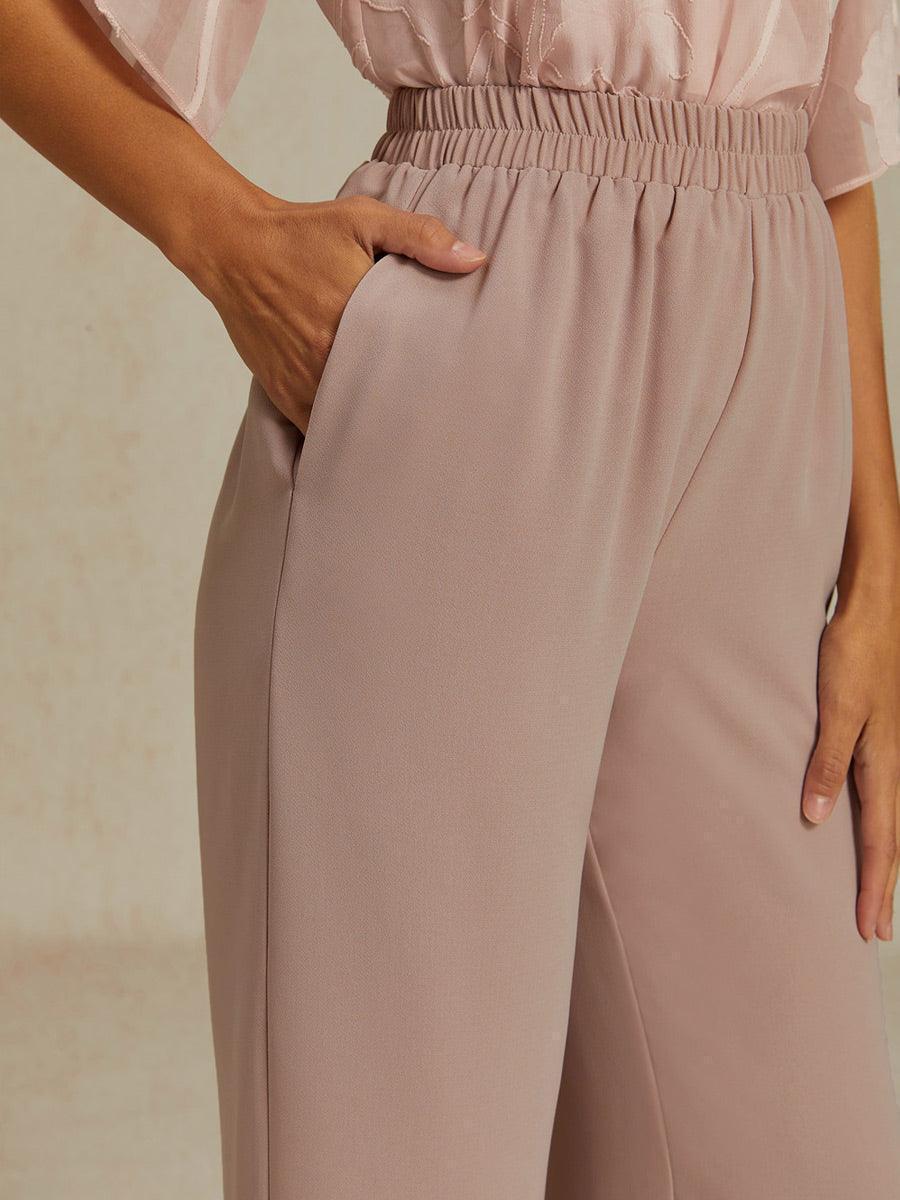 Weite Hose mit mittelhohem Bund und Taschen