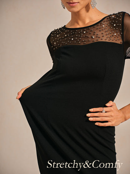 Elegante abito a tubino da cocktail con scollo in rete illusion decorata