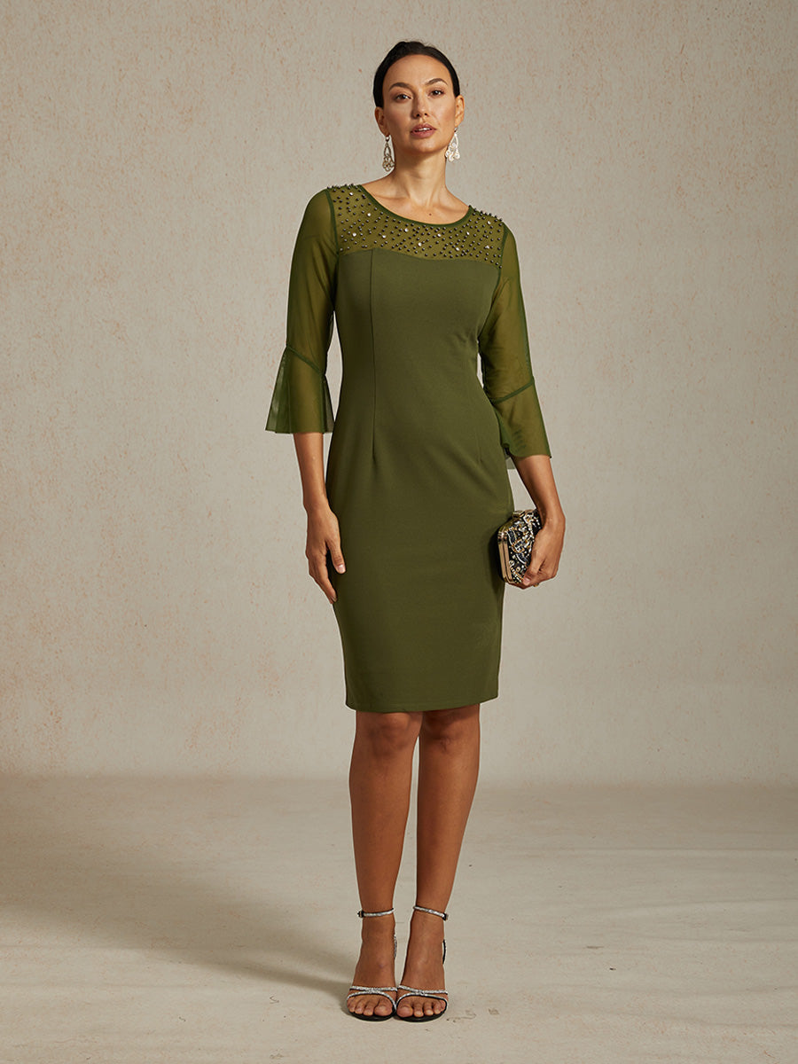 Elegante abito a tubino da cocktail con scollo in rete illusion decorata