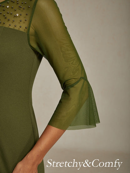 Elegante abito a tubino da cocktail con scollo in rete illusion decorata