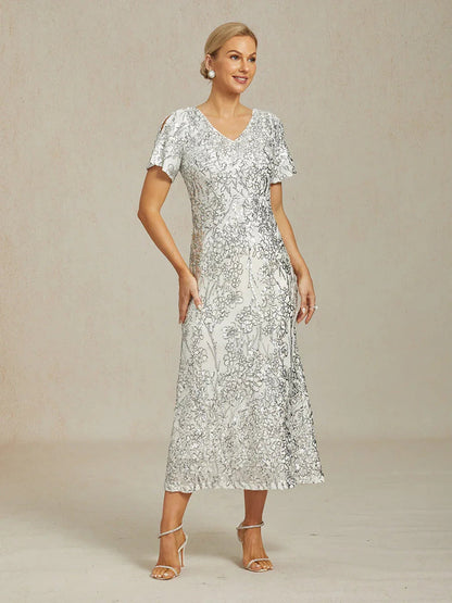 Vestito elegante con scollo a V, spalle scoperte e paillettes