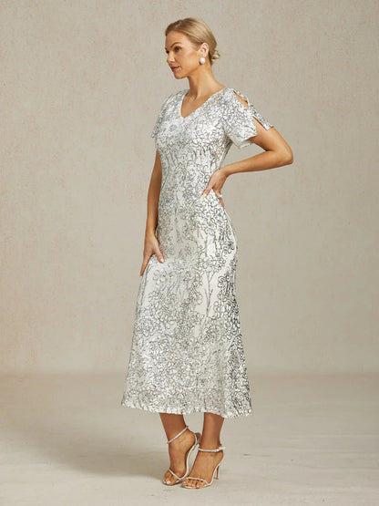 Vestito elegante con scollo a V, spalle scoperte e paillettes