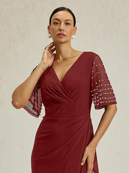 Elegantes Abendkleid mit verzierten Volantärmeln