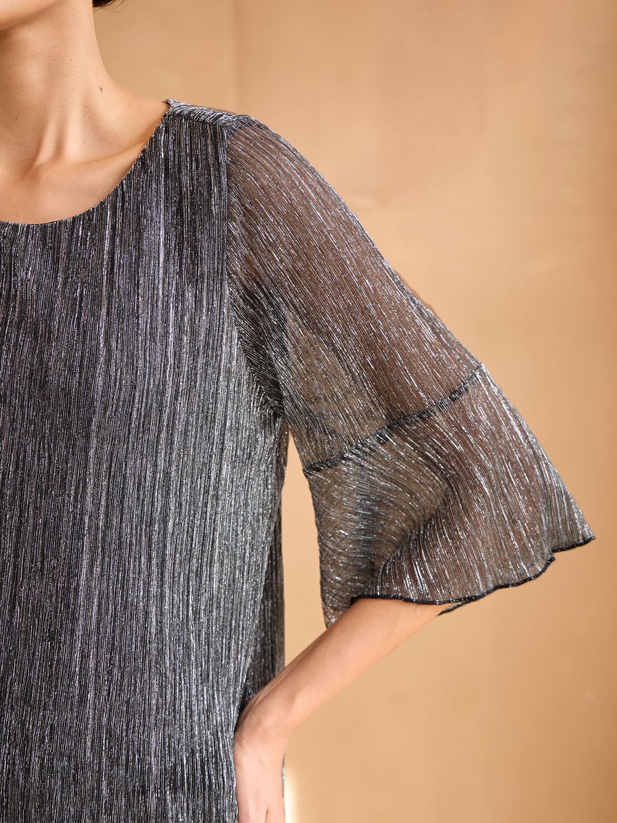 Blusa stratificata plissettata metallizzata