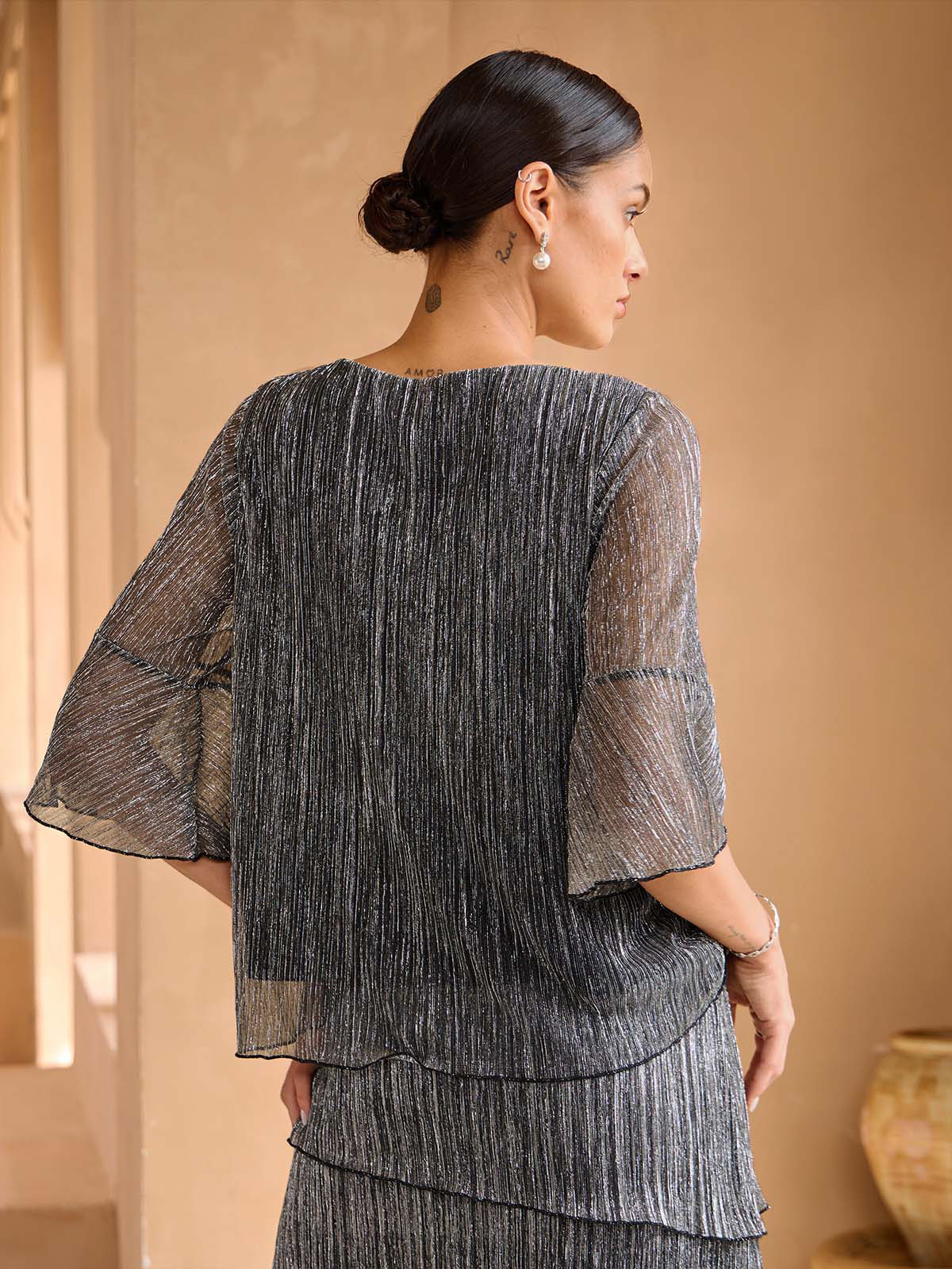 Blusa stratificata plissettata metallizzata