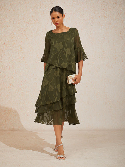 Elegant chiffonbluse med asymmetrisk kant
