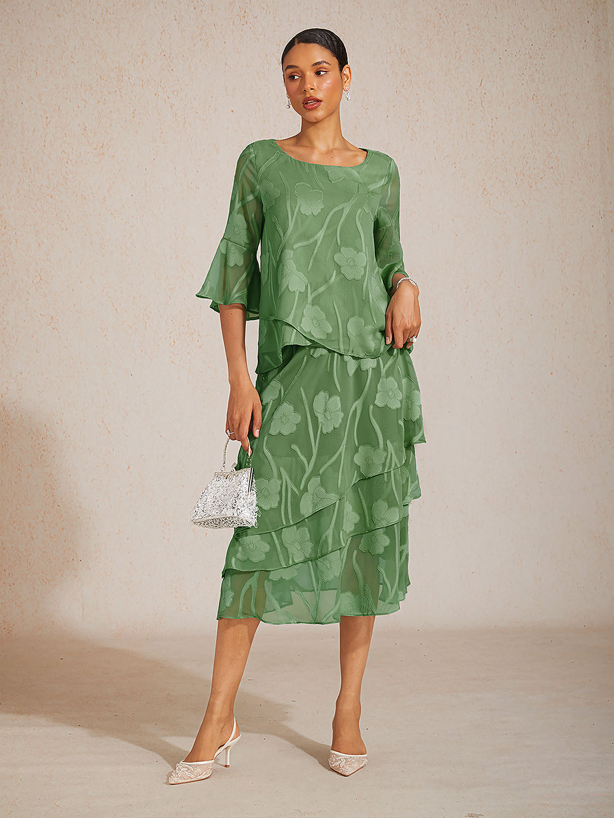 Blusa elegante de gasa con dobladillo asimétrico