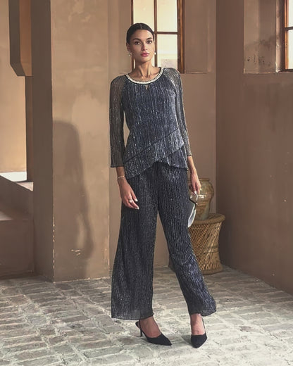 Blusa in chiffon glitter plissettato a strati
